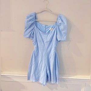 Blue romper with puff sleeves and waist cutouts. Size medium.